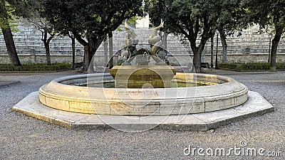 Fountain of the Dolphins in the gardens of the Parterre di Cortona in Cortona, Italy. Editorial Stock Photo