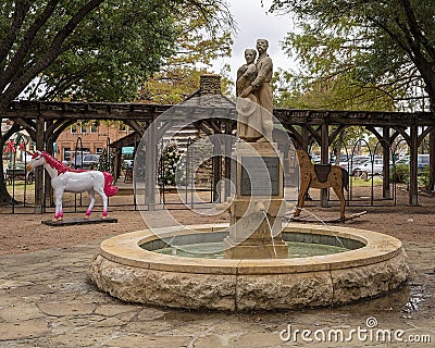 `Walking to Texas` by sculptor Michael Cunnigham in the historic district of Grapevine, Texas. Editorial Stock Photo