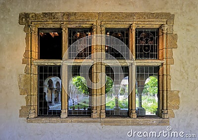 French 15th century limestone window in the Cloisters in New York City. Editorial Stock Photo