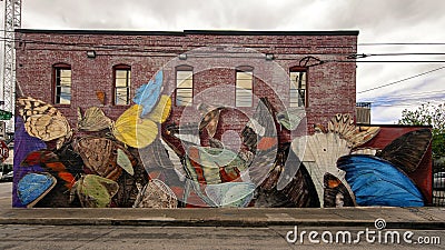 Colorful moth mural on the side of a building in Deep Ellum in Dallas, Texas Editorial Stock Photo