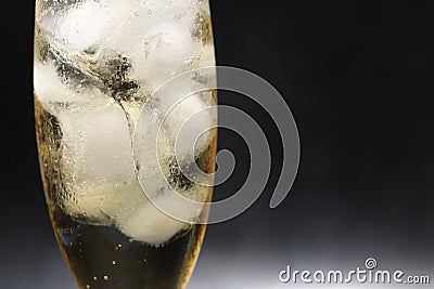 A glass of ginger ale in a black background Stock Photo