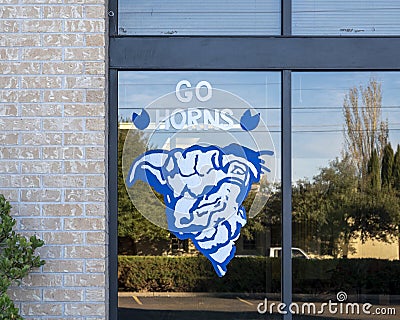 `Go Horns` sign in the window of a business in Marfa, Texas. Editorial Stock Photo