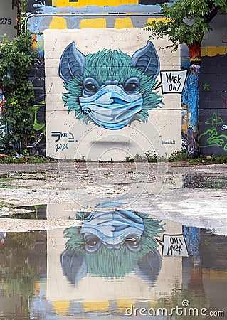 Graffiti mural at the Fabrication Yard in Oak Cliff featuring surrealistic animal wearing a coronavirus protection mask. Editorial Stock Photo