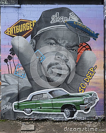 Graffiti style mural by SHiQ14 at the Fabrication Yard in Dallas, Texas, featuring Ice Cube. Editorial Stock Photo