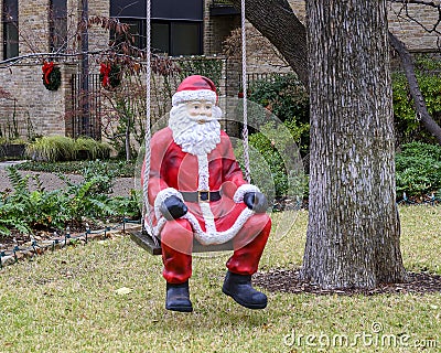 Statue of Santa Claus in a swing in Dallas, Texas Stock Photo