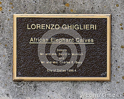 Information plaque for `African Elephant Calves`, a bronze five-piece fountain group by Lorenzo Ghiglieri at the Dallas Zoo, Texas Editorial Stock Photo