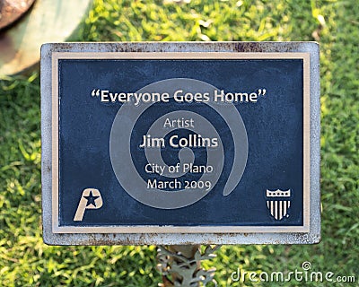 Information plaque for `Everyone Goes Home` by artist Jim Collins outside the Fire Department in Plano, Texas. Editorial Stock Photo
