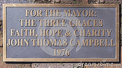 Information Plaque for `The Three Graces` by John Thomas Campbell located in the Denton City Offices Courtyard. Editorial Stock Photo