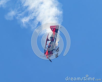 Jeremy Holt piloting his Pegasus Pitts Model 12 acrobatic biplane in the airshow July 4th at Grand Lake, Oklahoma. Editorial Stock Photo