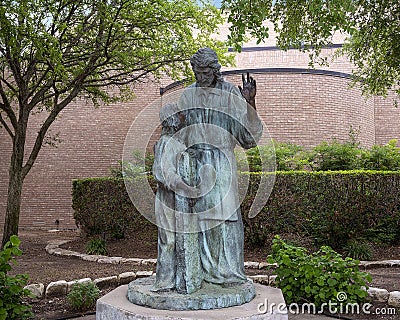 `Joseph Teaching Jesus`, a life-size metal sculpture at Saint Joseph Catholic Church in Arlington, Texas. Editorial Stock Photo