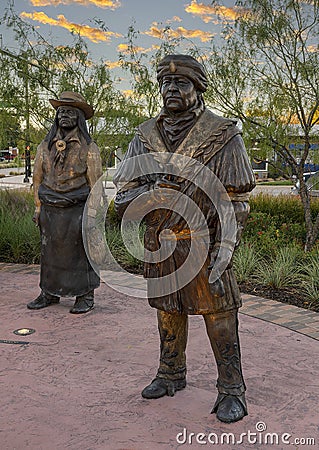 Life-size bronze sculpture of two chiefs by Linda Lewis, part of an art piece titled `The Peace Circle` in historic Grapevine. Editorial Stock Photo