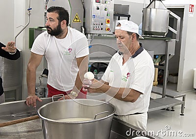 Mozzarella cheese making demonstration at L`Amordi Latte, a company that produces all types of cheese in Cavallino, Italy. Editorial Stock Photo