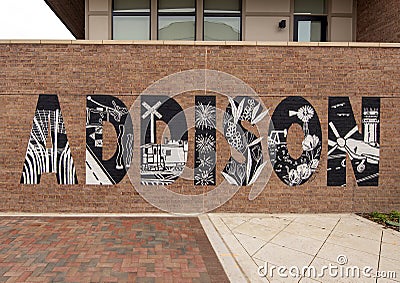 Mural by Ali Koch on an outside wall of an apartment building in Addison, Texas. Editorial Stock Photo