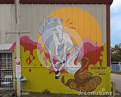 White stallion and rattlesnake mural by Brooklynd Turner for Wild West Mural Fest 2020 in West Dallas, Texas. Editorial Stock Photo
