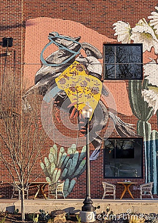 Mural featuring a woman on a horse on a restaurant wall in the Bishop Arts District in Oak Cliff in Dallas, Texas Stock Photo