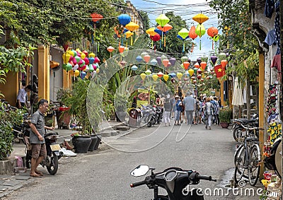 Narrow shopping street with colorful lampshades in Hoi An, Vietnam Editorial Stock Photo