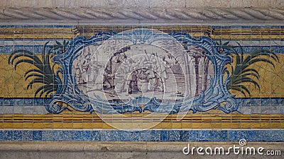 Blue, yellow and green azulejo tile panels on the side walls of the refectory of the Jeronimos Monastery in Lisbon, Portugal. Stock Photo