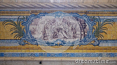 Blue, yellow and green azulejo tile panels on the side walls of the refectory of the Jeronimos Monastery in Lisbon, Portugal. Stock Photo