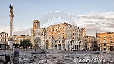 Piazza Sant`Oronzo in Lecce with a tall monument capped with a statue of Saint Orontius of Lecce Editorial Stock Photo