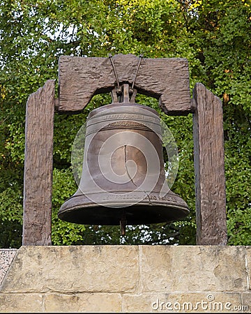 Replica Liberty Bell sculpture atop the Wall of Commemoration in the Veteran`s Memorial Park in the City of Irving, Texas. Editorial Stock Photo