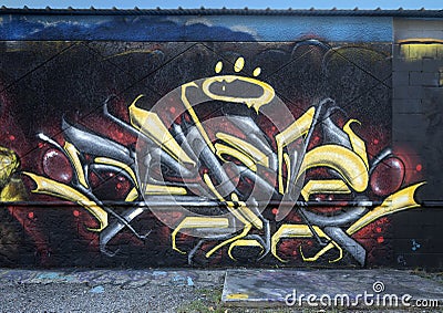 Right side of a graffiti style mural featuring Rapper Mo3 on Fabrication Street in Dallas, Texas. Editorial Stock Photo