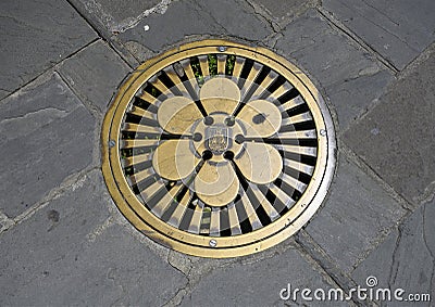 Brass Plate for access to underground electrical lines in Portofino, Italy. Stock Photo