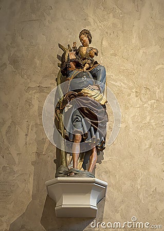 `Saint Christopher`, a limewood with paint and gilding statue circa 1520, on display in the Cloisters in New York City. Editorial Stock Photo