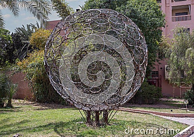 `Globe Terrestrial` by multiple artists in the Garden of the Arts in Marrakech, Morocco. Editorial Stock Photo