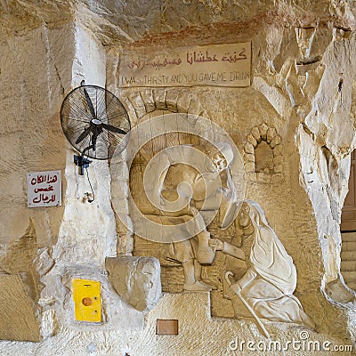 Sculpture and verse representing Samson and Delilah inside Saint Simon the Tanner`s Hall in the Mokattam Mountains, Cairo region. Editorial Stock Photo