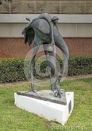 Whimsical bronze sculpture titled `Endangered Species` by David Cargill, located outside the World Trade Center in Dallas, Texas. Editorial Stock Photo