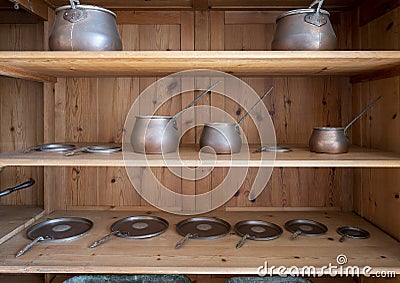 Shelves with copper utensils in the main kitchen in service of the Pena Palace in Sintra, Portugal. Stock Photo