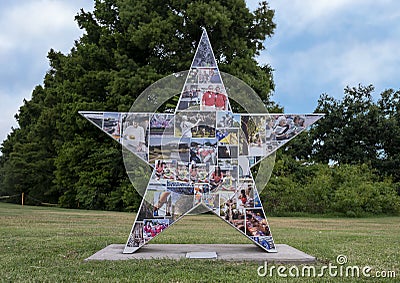 Six foot fiberglass star sculpture titled `A Day in the Life`, by artist Amy Schulz in Arlington, Texas Editorial Stock Photo