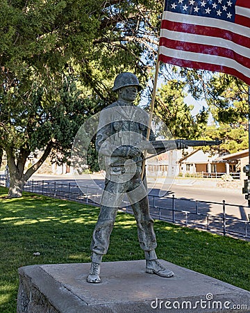 Small bronze statue of Sargent Manuel Gonzales on the Courthouse lawn in Fort Davis. Editorial Stock Photo