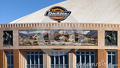 South facade of Dickies Arena with `Los Caballeros` mural by William Matthews flanked by bas-relief sculptures by Buckeye Blake. Editorial Stock Photo