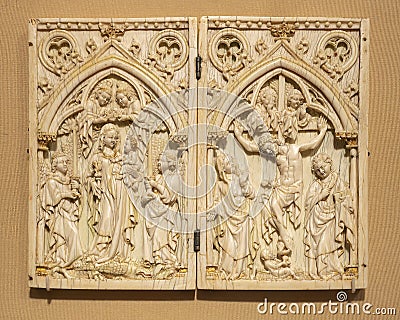 South German 14th century elephant ivory pax with the crucifixion in the Cloisters in New York City. Editorial Stock Photo