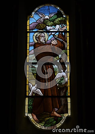 Stained glass of Saint Francis taming the white doves, Church of Saint Martin, Portofino, Italy Stock Photo