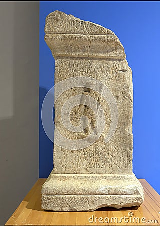 Statue base with low relief of Aulisua on display at the Archaeological Site of Volubilis in Morocco. Editorial Stock Photo