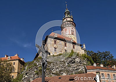 Jesus on the Cross with Cesky Krumlov Castle in the background, Czech Republic Stock Photo