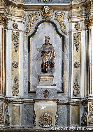 Statue of a man in a side altar in the Sanctuary of Our Lady of Nazare, Portugal. Editorial Stock Photo