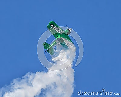 Stephen Covington piloting the Raptor, his Pitts S2S acrobatic biplane in the airshow July 4th at Grand Lake, Oklahoma. Editorial Stock Photo