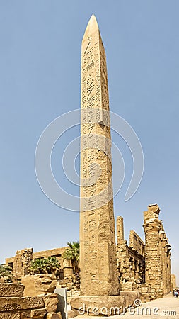 Thutmose I Obelisk with the 3rd Pylon and the South side Hypostyle Hall in background in Karnak Temple complex near Luxor, Egypt. Stock Photo