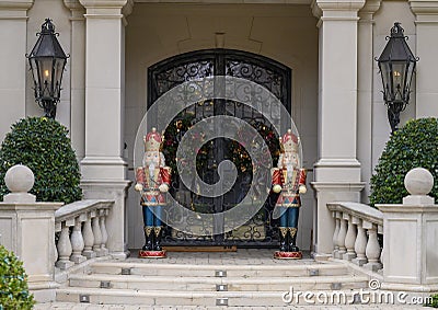 Two Nutcrackers guarding the door of a mansion in Highland Park at Christmas in Dallas County, Texas Stock Photo