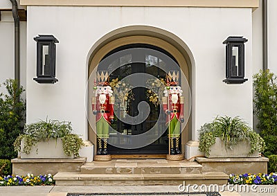 Two Nutcrackers guarding the door of a mansion in Highland Park at Christmas in Dallas County, Texas Stock Photo