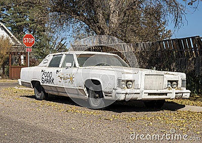 Vintage 1977 Lincoln Town Car with Food Shark painted on the side in Marfa, Texas. Editorial Stock Photo