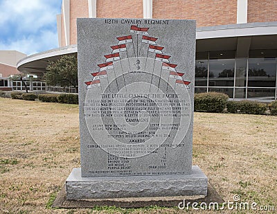 War monument to 112th Calvary Regiment in the Veterans Memorial Garden with Dallas Memorial Auditorium in the background. Editorial Stock Photo