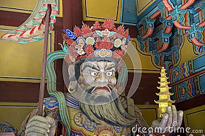 Wooden statue, one of four Great Heavenly Kings often found at Korean temple gates, guardians of the four corners of heaven. Stock Photo
