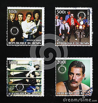 Pictures of band the Queen on a series of stamps Editorial Stock Photo