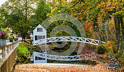 Picturesque arched white wooden foot bridge Stock Photo