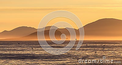 Picturesque arctic seascape. Mountains on the sea coast. Stock Photo