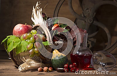 Picturesque autumn composition with basket, fruits, pumpkin, mug Stock Photo